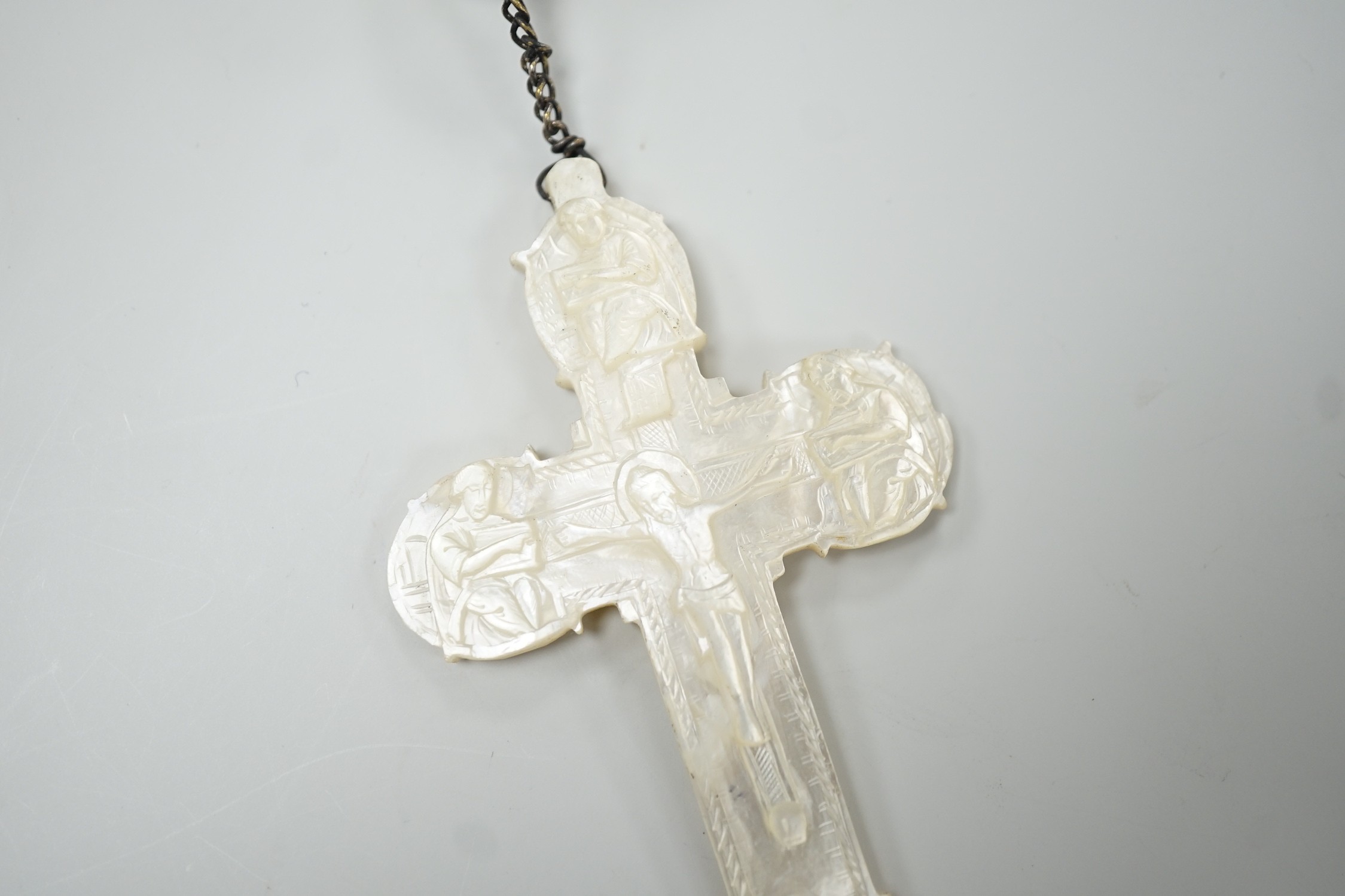A long mother of pearl rosary, 158cm, with carved mother of pearl crucifix pendant, 8cm.